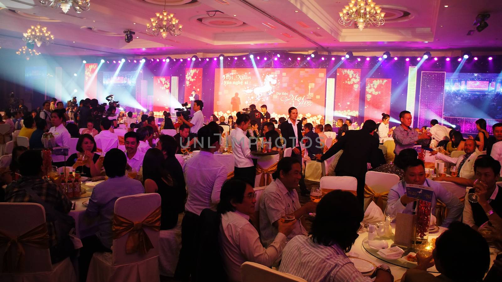 HO CHI MINH CITY, VIET NAM- JAN 15:Vietnamese artists world enjoy a year end party, colorful stage, famous people drinking and have dinner with happiness, cheerful with frieds in Vietnam, Jan 15, 2013