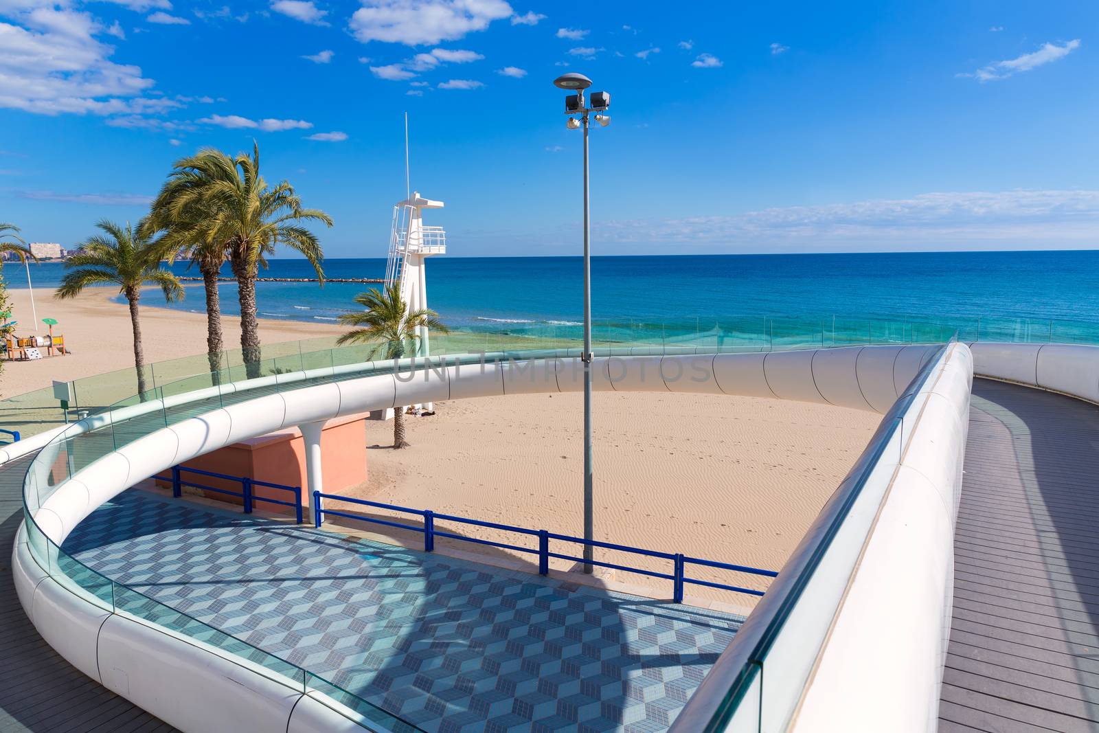 Alicante el Postiguet beach playa with modern pedestrian white bridge at Spain