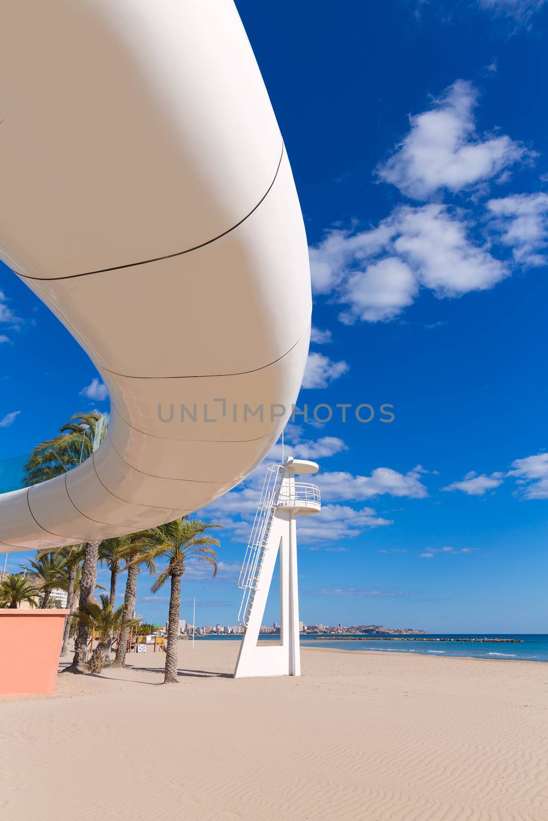 Alicante el Postiguet beach playa with modern pedestrian white bridge at Spain