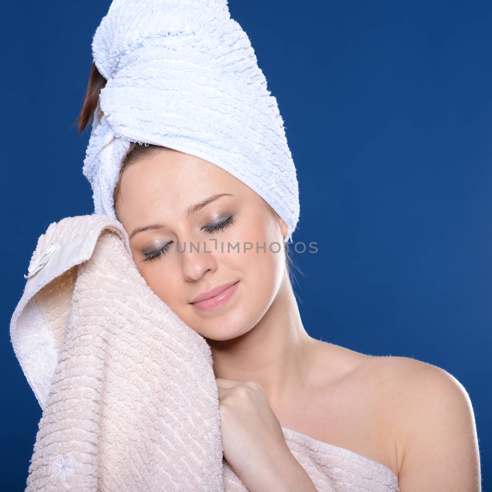 Beautiful young woman with towel