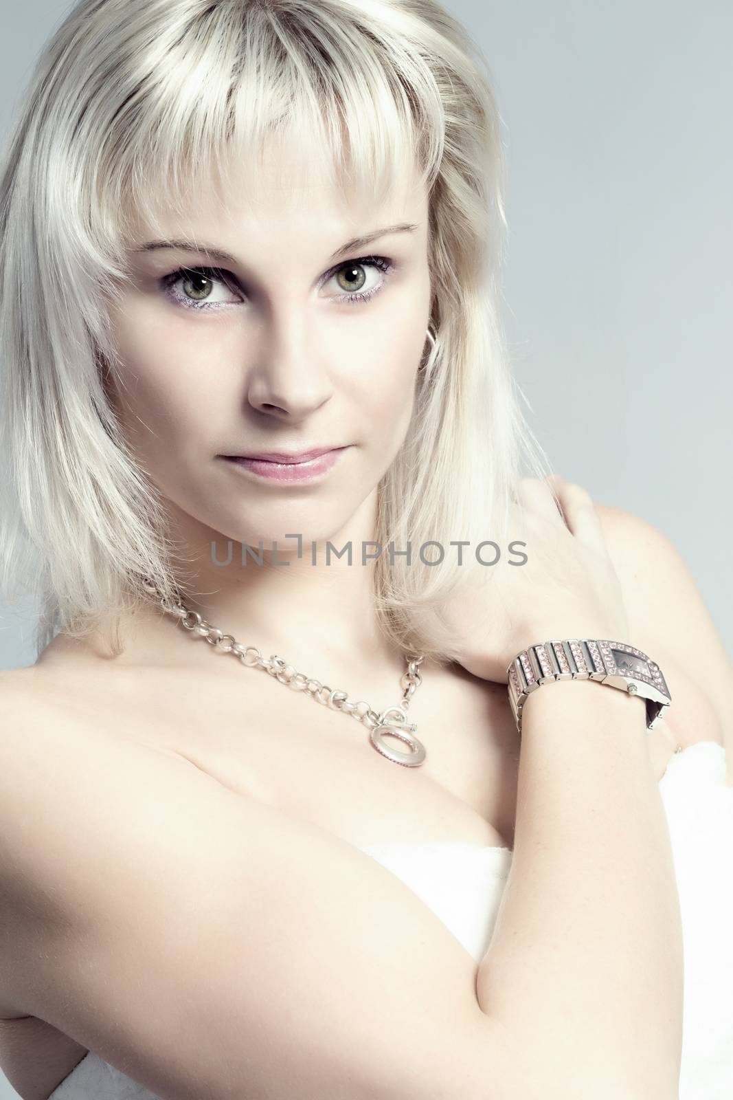 studio portrait of beautiful woman with white dress
