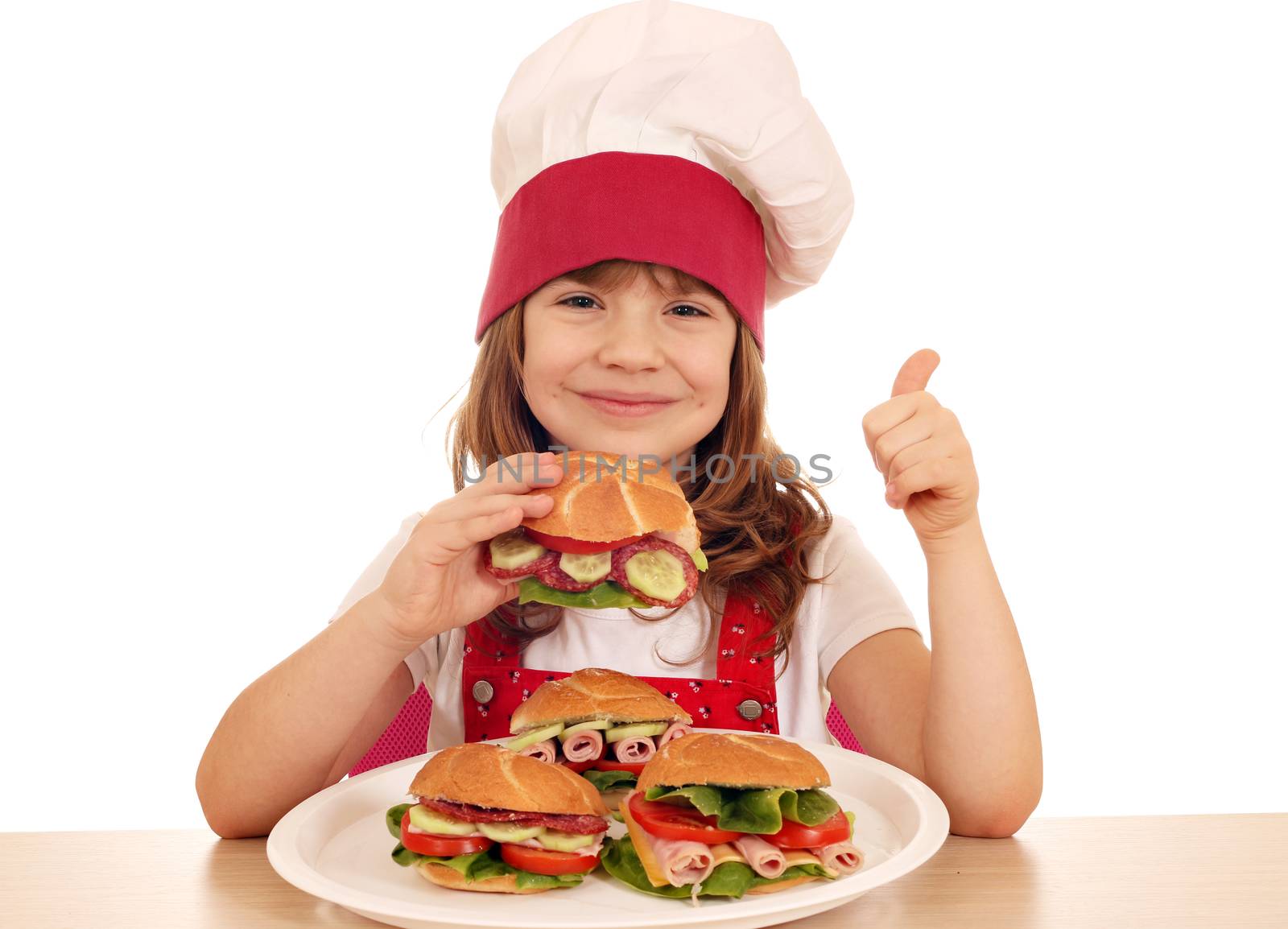 happy little girl cook with sandwich and thumb up by goce