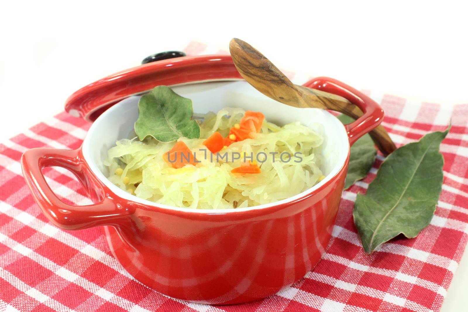 fresh cabbage with carrots and bay leaf