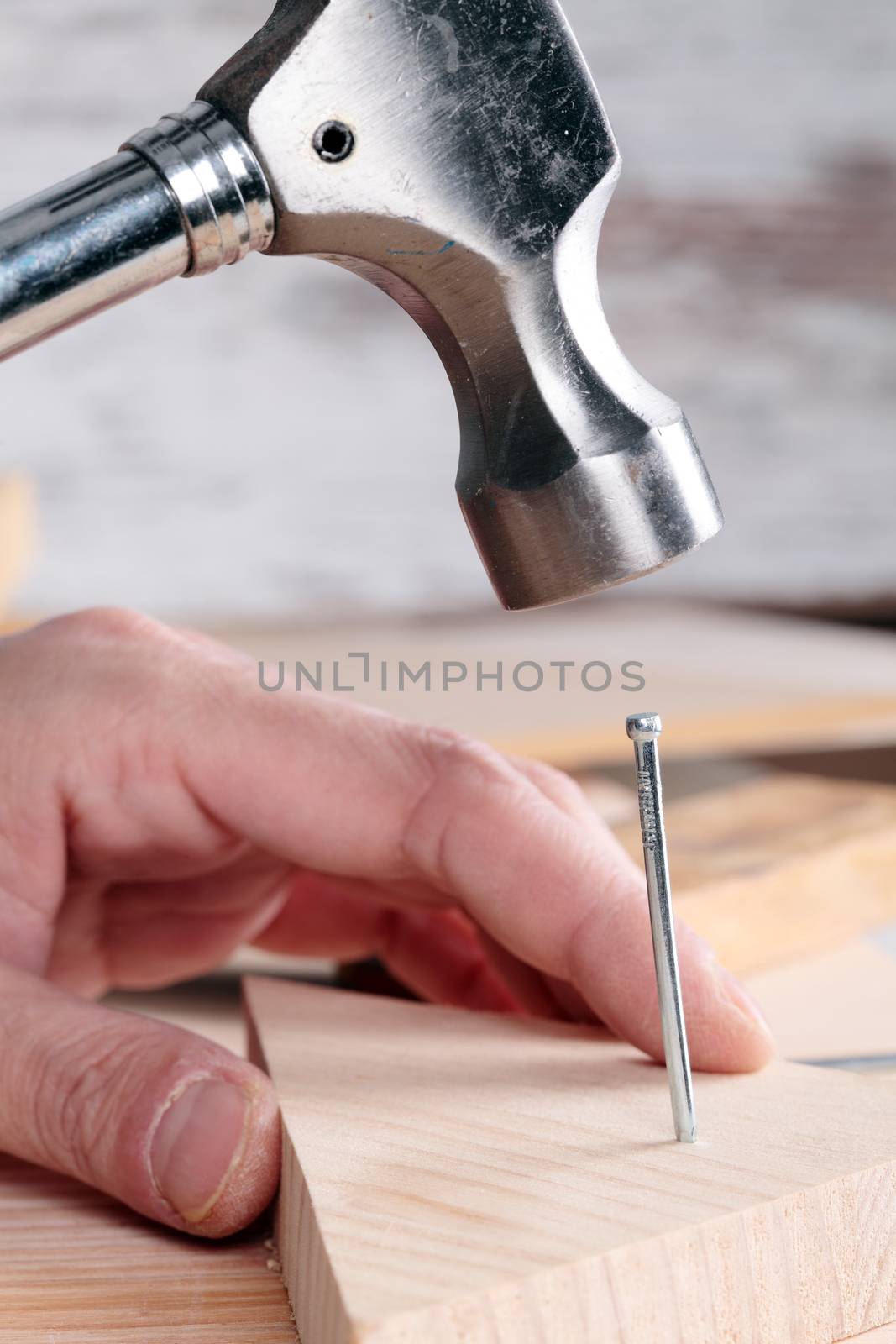 detail of a nail and a hammer