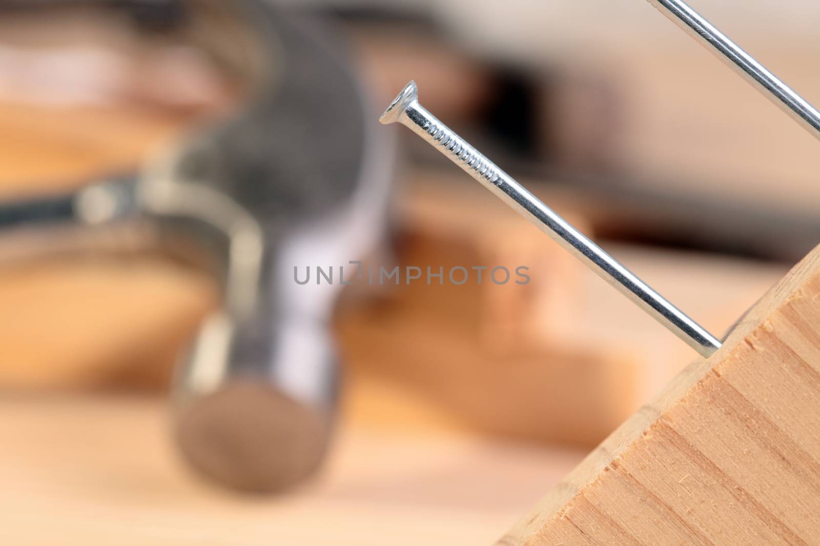 detail of a nail and a hammer