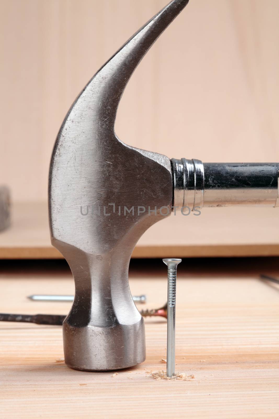 detail of a nail and a hammer