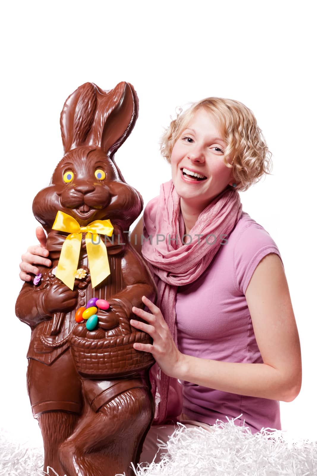 Girl Laughing and Holding a HUGE Chocolate Easter Bunny Isolated On White Background