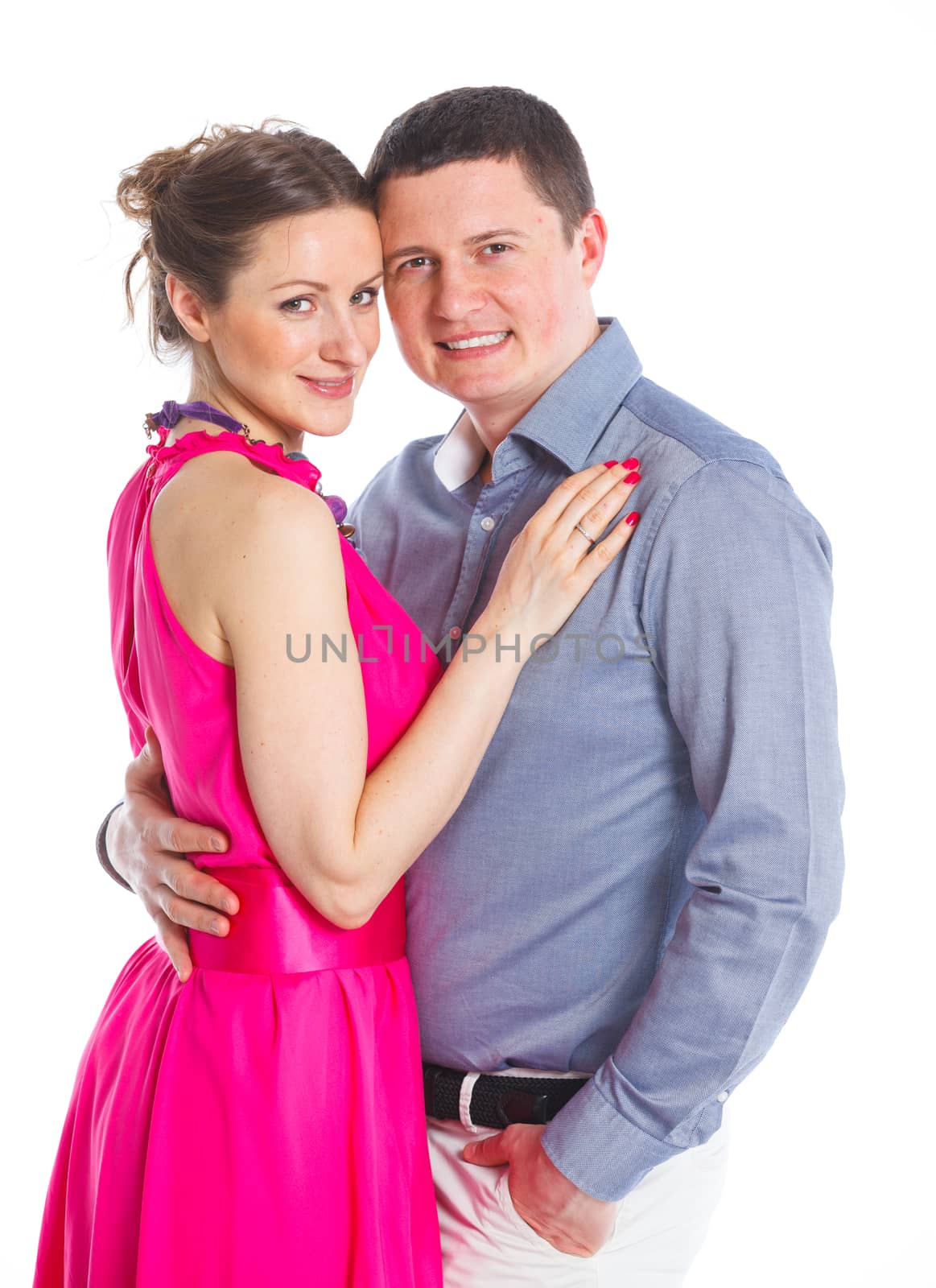 Happy couple. Attractive man and woman being playful. Isolated on white background.