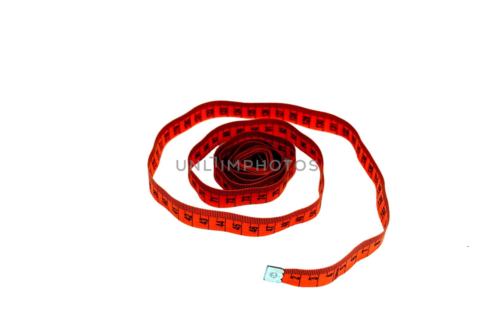 Orange on white background measuring tape spirally wound