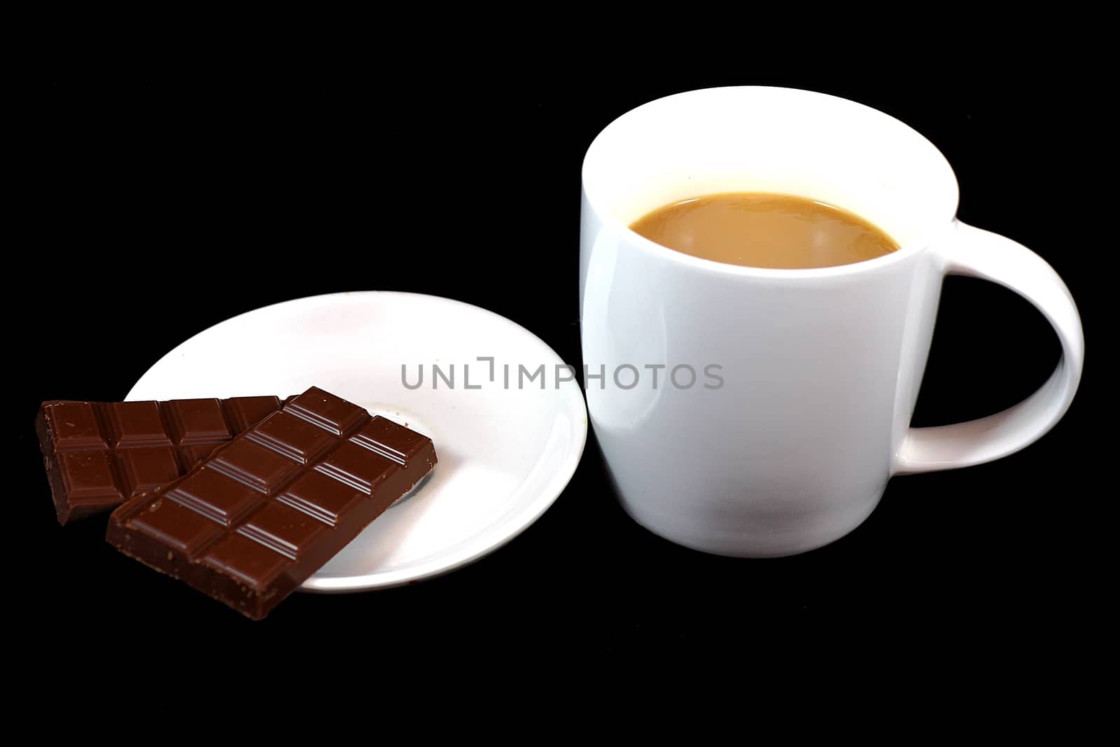 stand on a black background cup of coffee and chocolate is