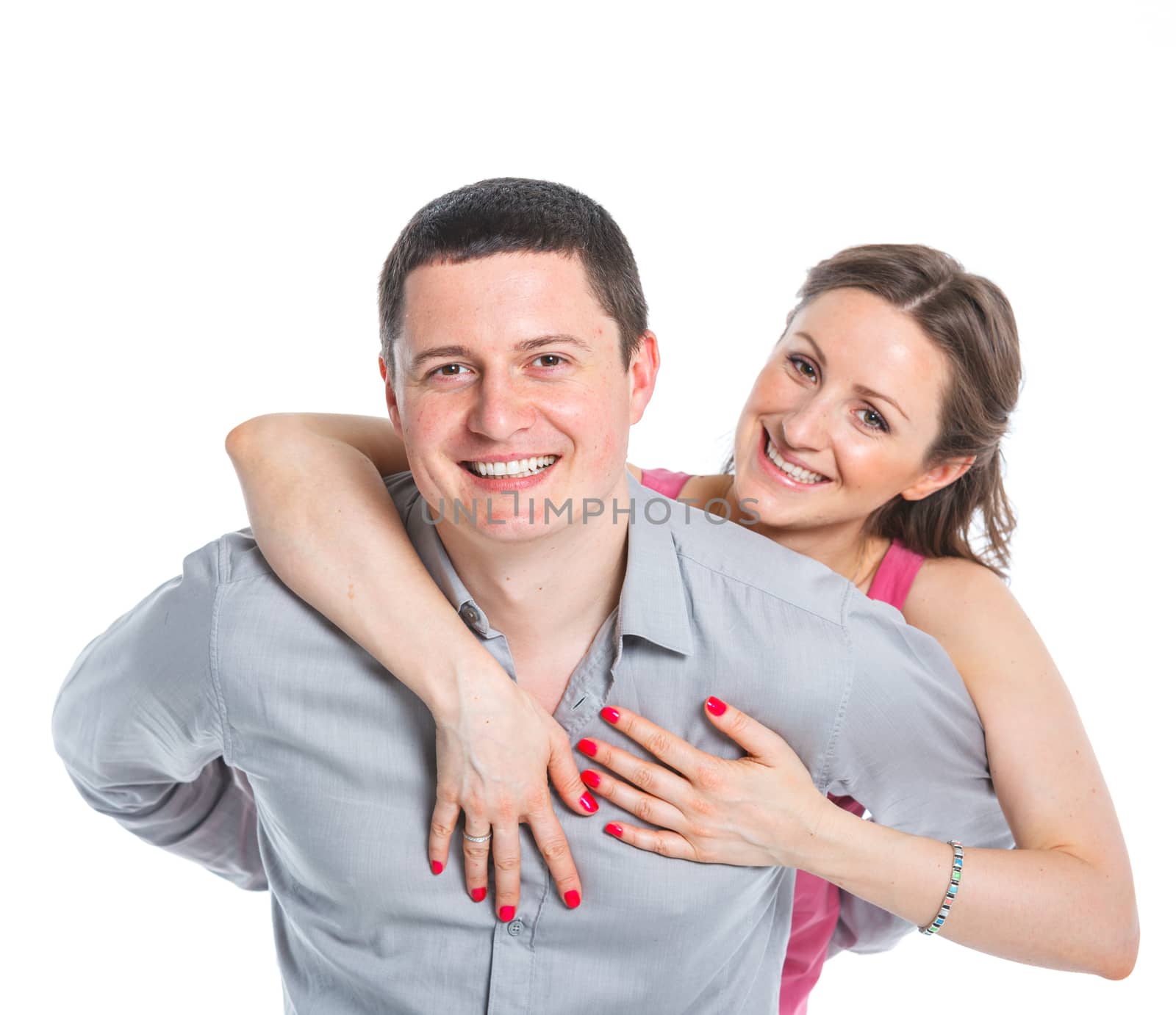 Portrait of happy couple. Attractive man and woman being playful. Isolated on white background.