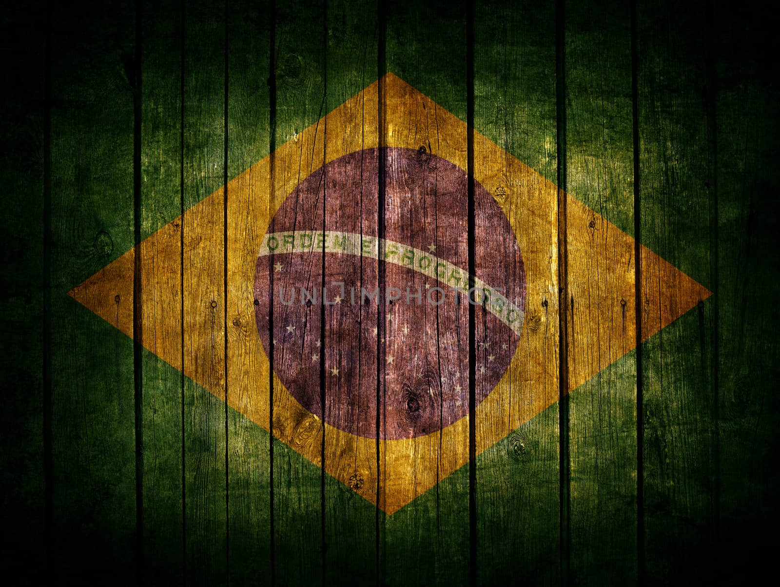 Very old dark brown wooden planks background with Brazil flag painted on it