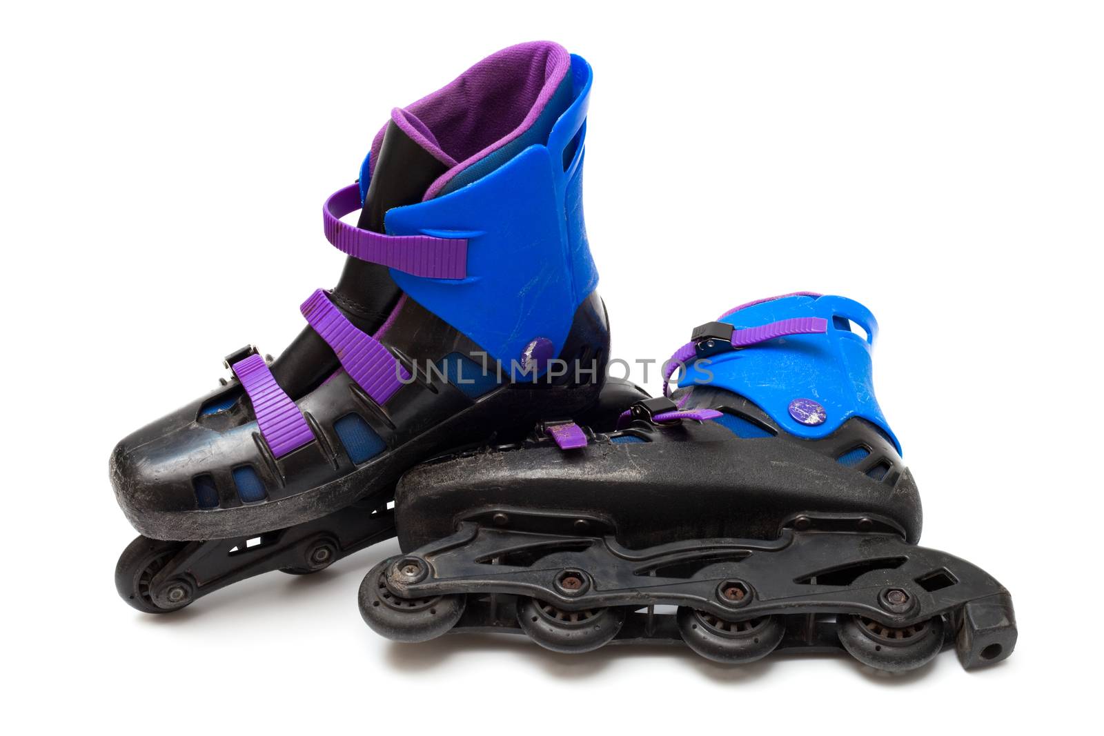 old roller blades on a white background