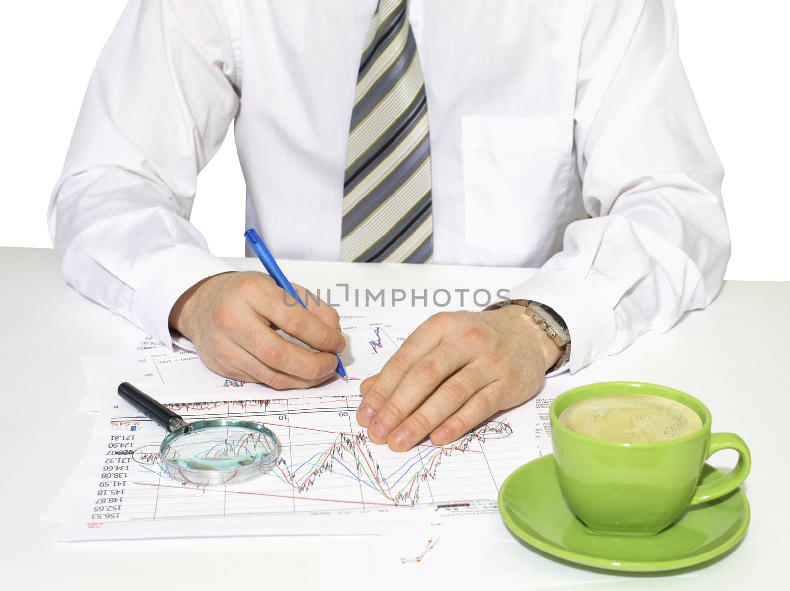 Businessman sitting at a table and writes by cherezoff