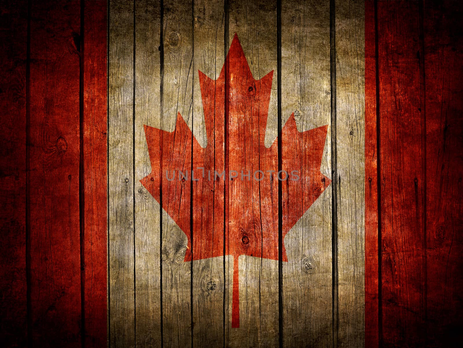 Very old dark brown wooden planks background with Canadian flag painted on it