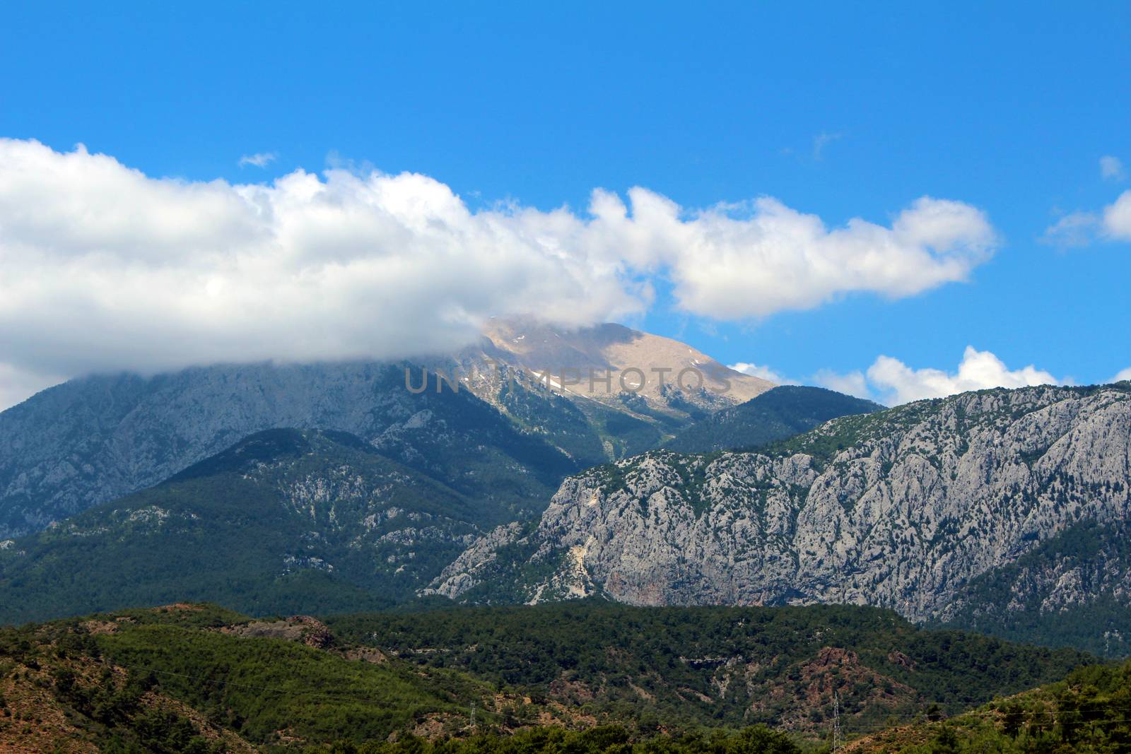 Turkish mountains covered with vegetation. Sky and clouds