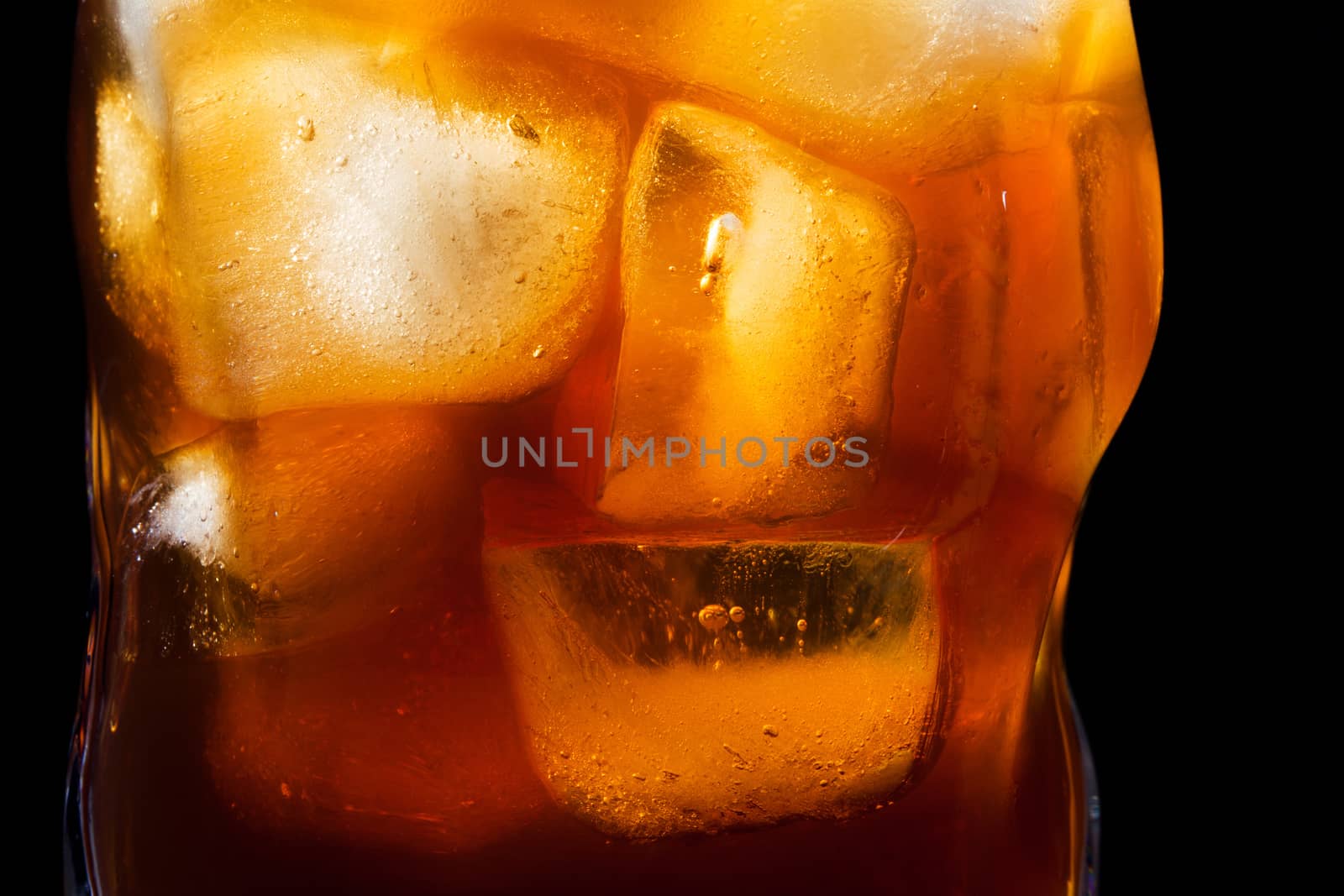 whiskey and ice in a glass closeup
