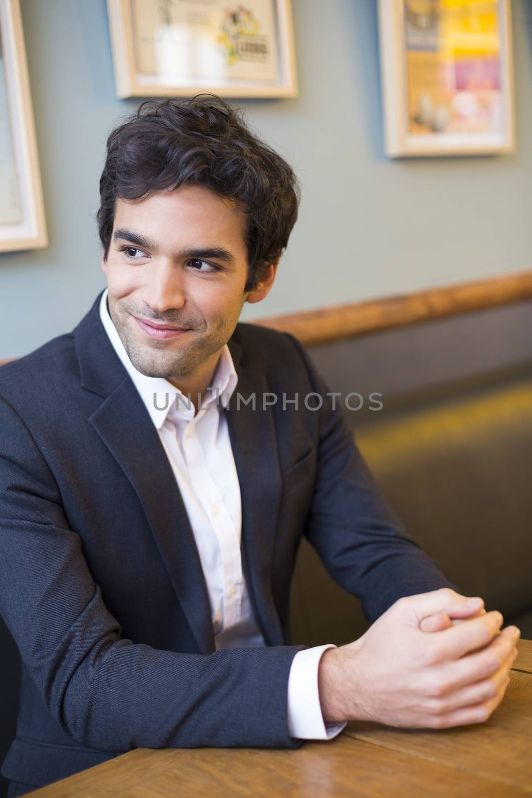 Portrait of handsome man in restaurant by LDProd