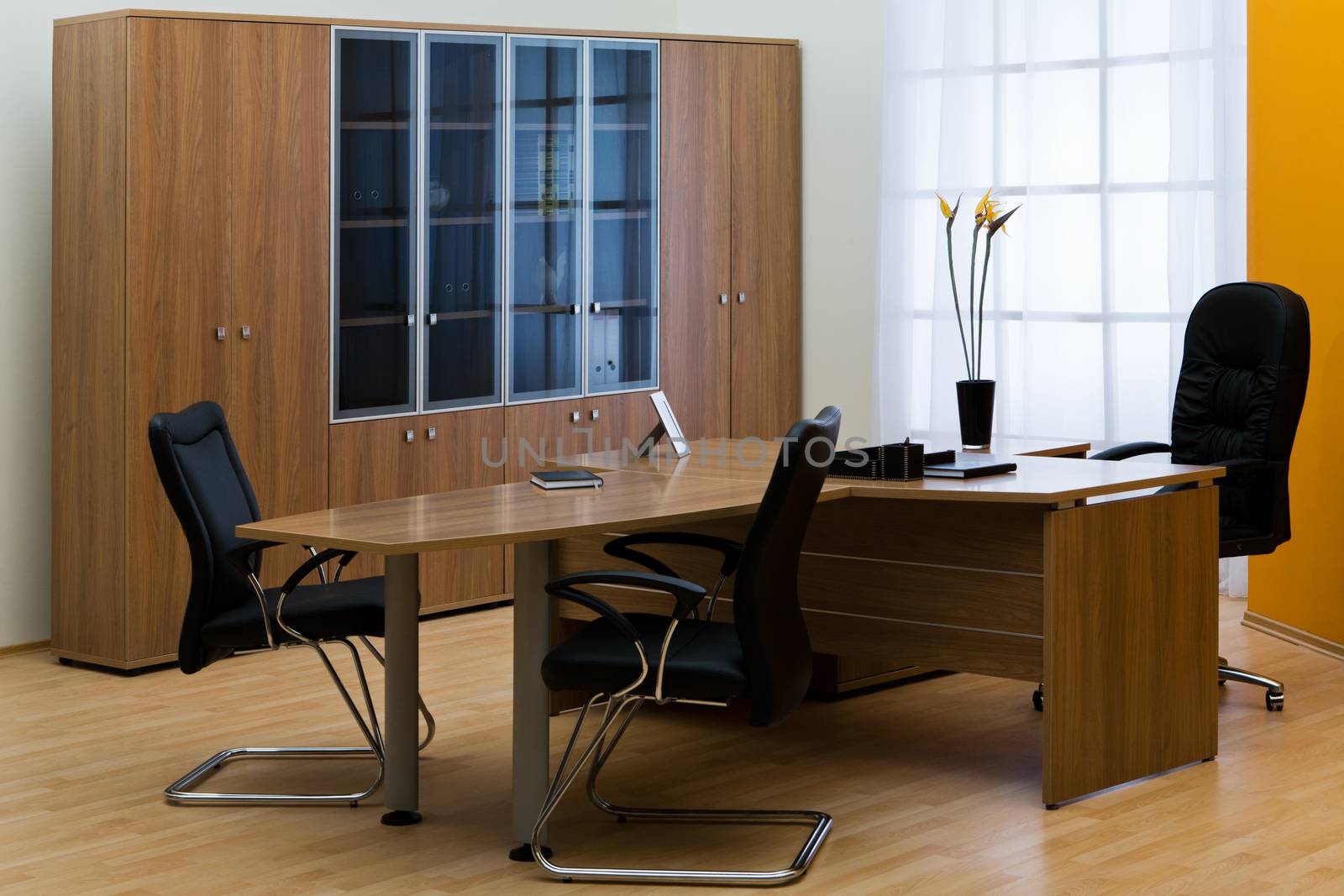 large wooden desk in a modern office