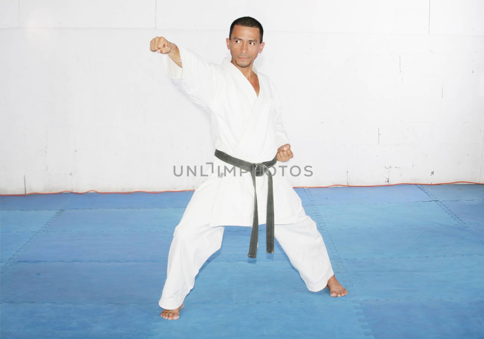 Man training karate in the gym by dacasdo