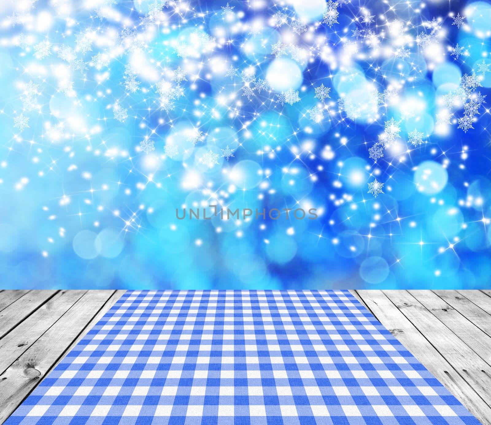 Empty wooden deck table with winter bokeh background. Ready for product display montage. 