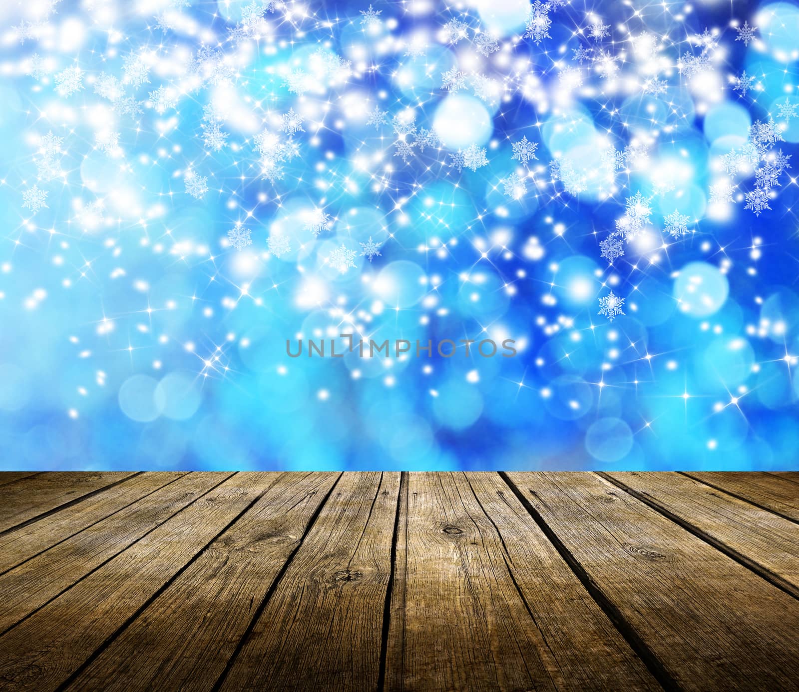 Empty wooden deck table with winter bokeh background. Ready for product display montage. 