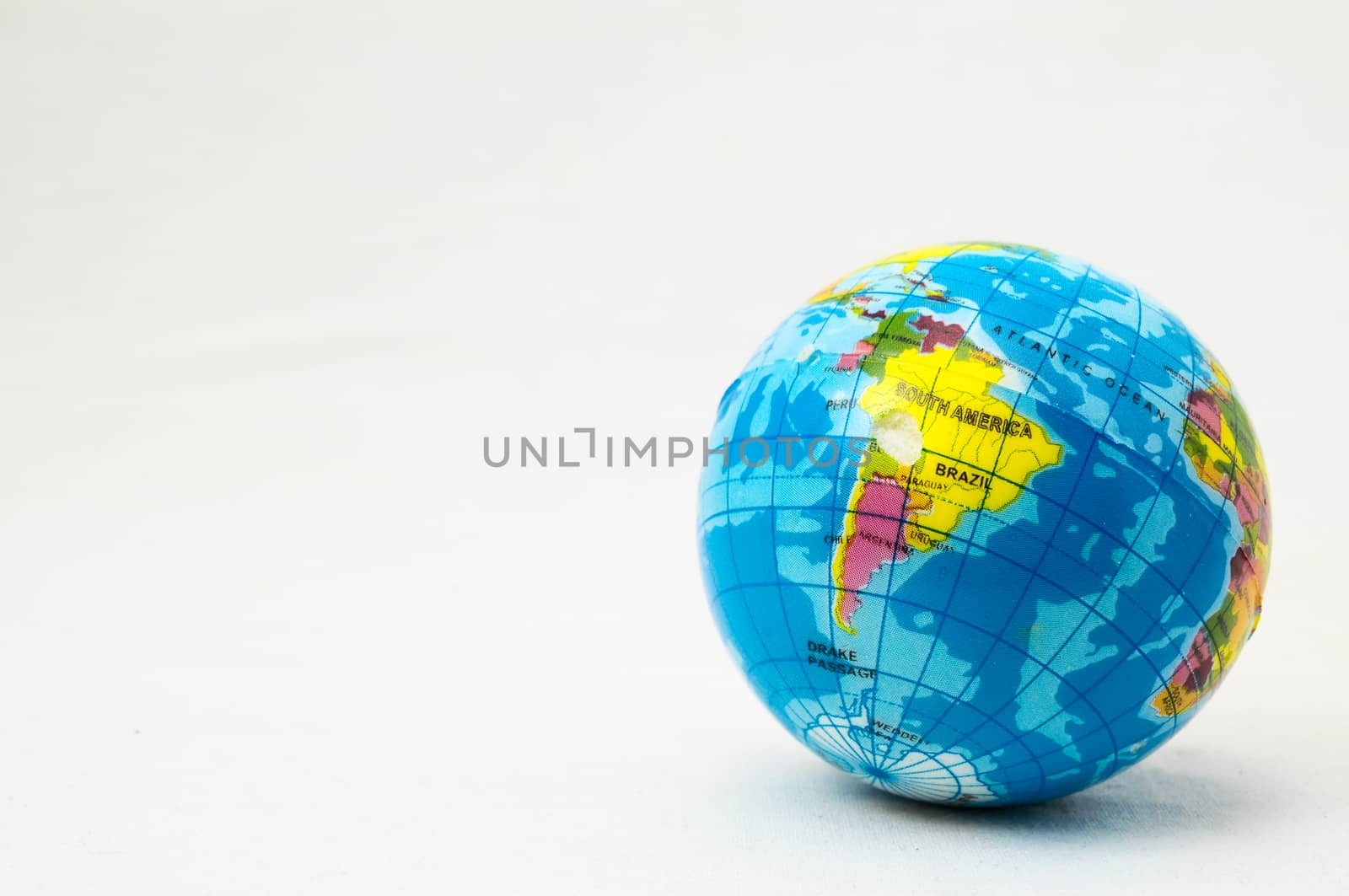 The World Globe Made of Rubber on a White Background