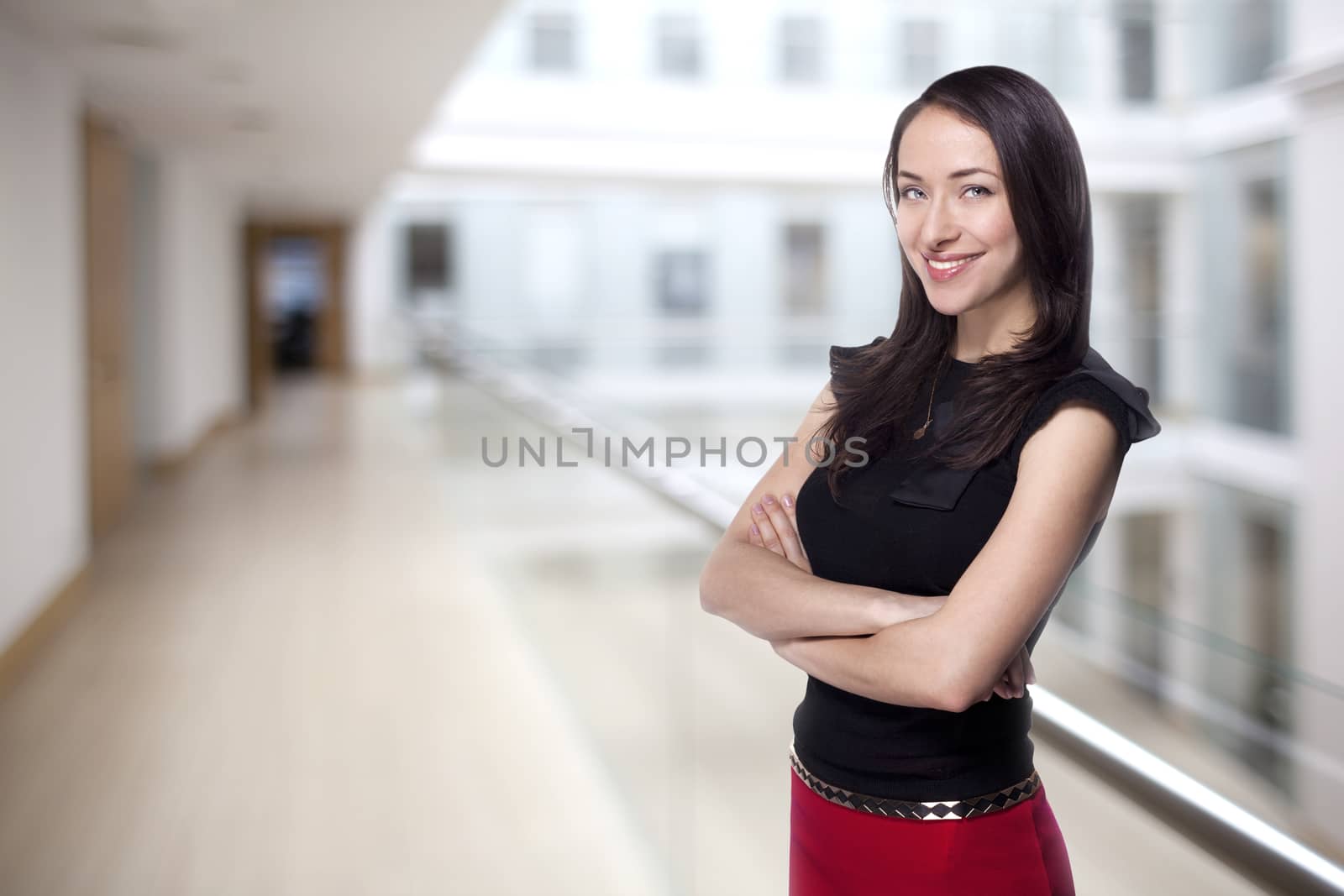 Young business woman smiling in the office building