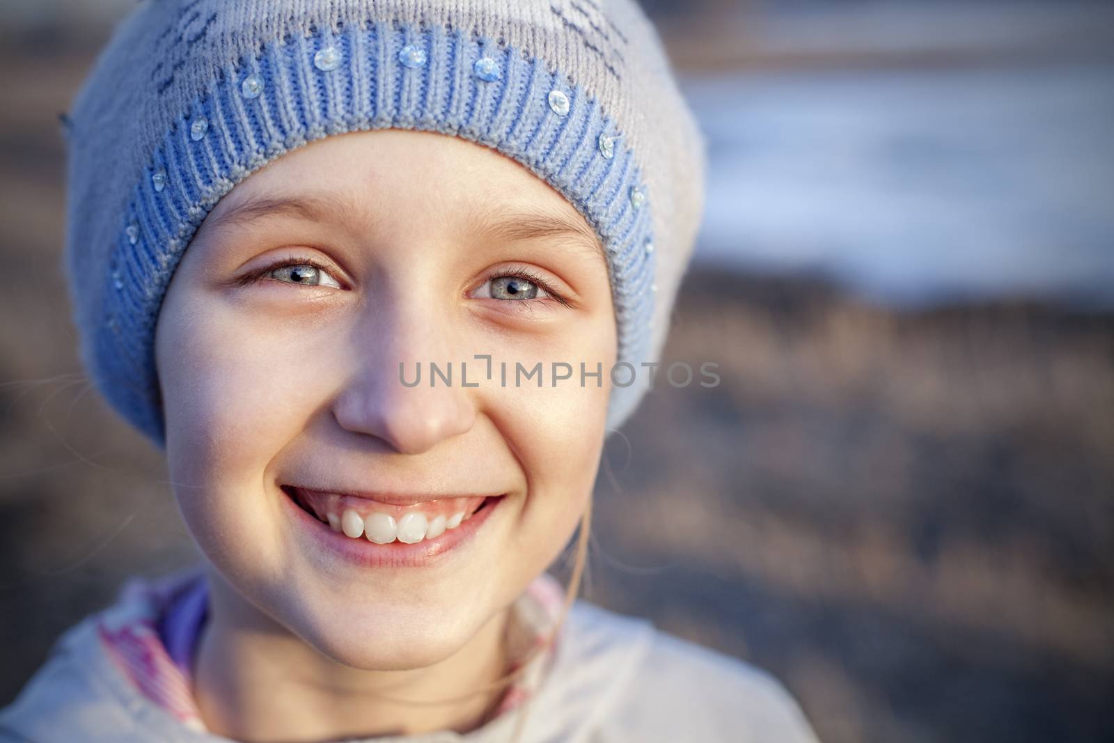 Outdoor portrait of a cute little girl by anelina