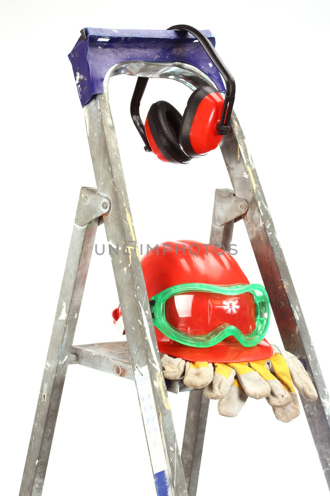 Safety gear kit on step ladder over white