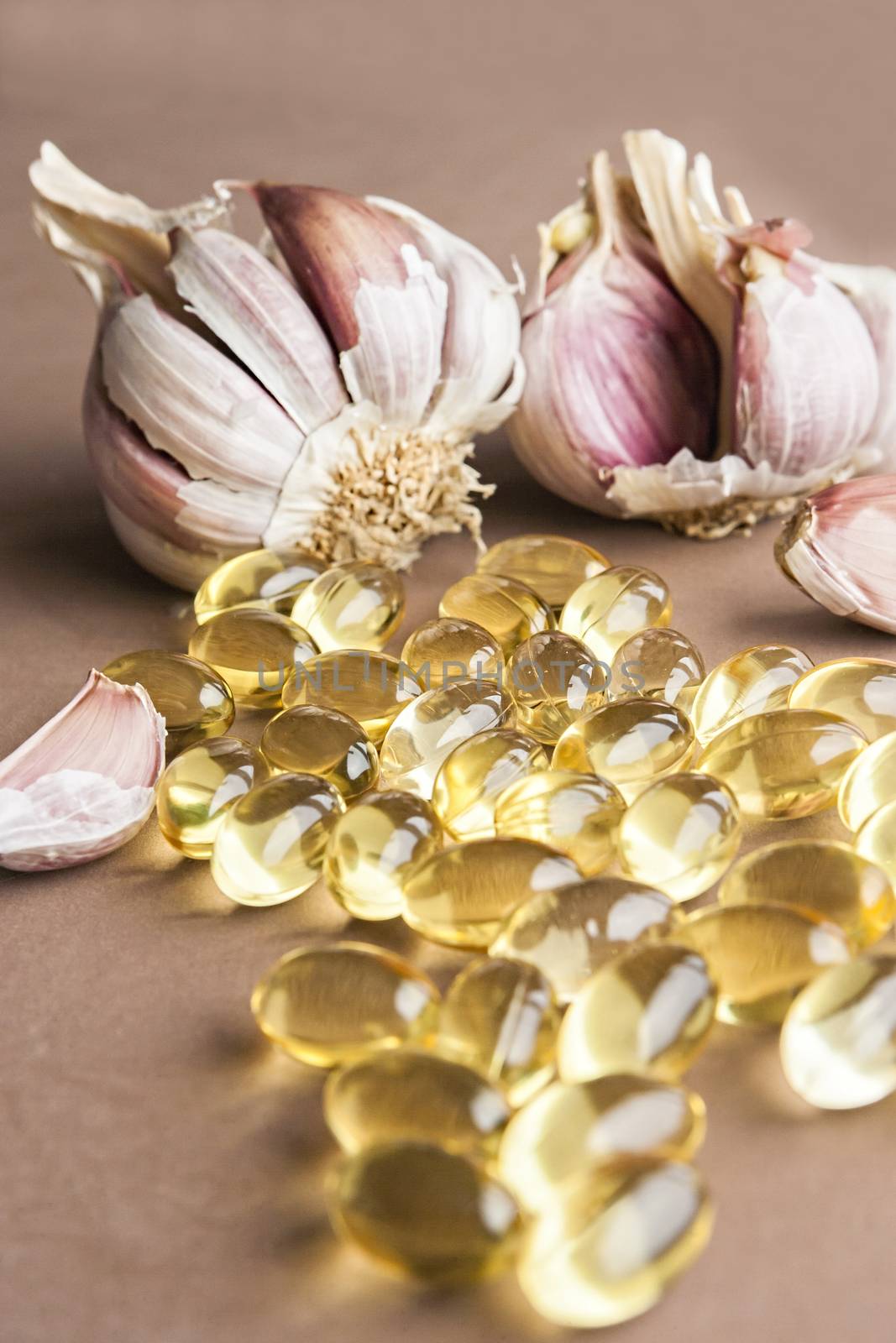 Garlic oil capsules, vitamins d pills  by digicomphoto