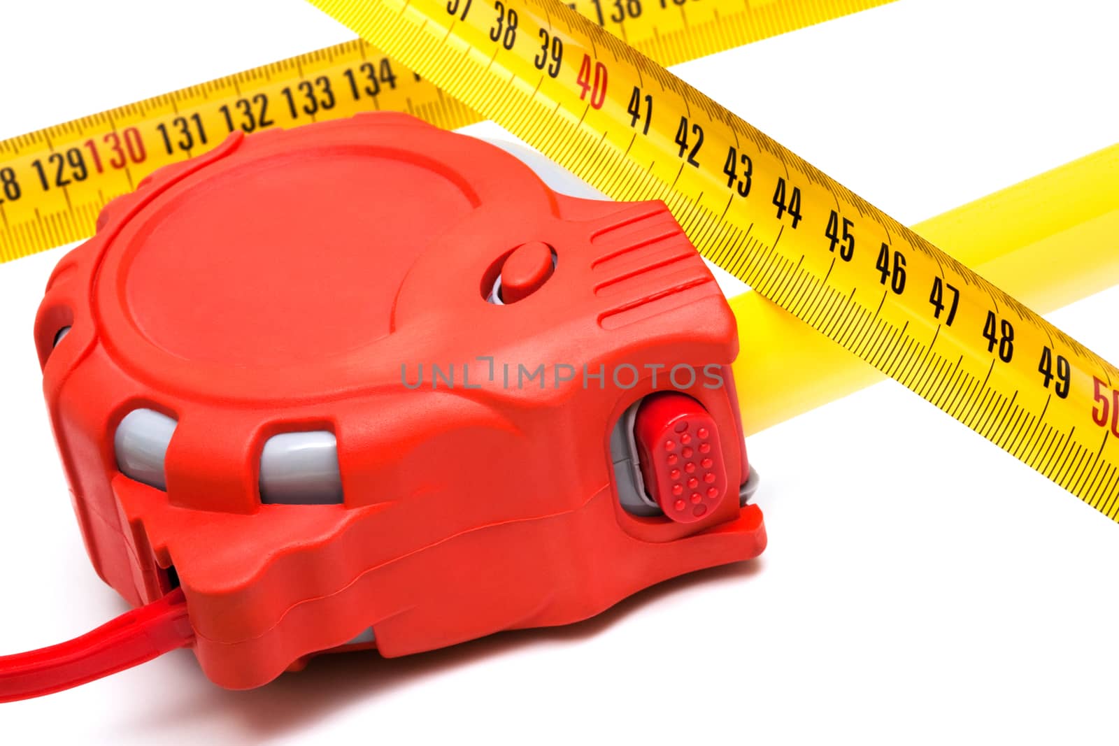 Red new tape-measure on a white background