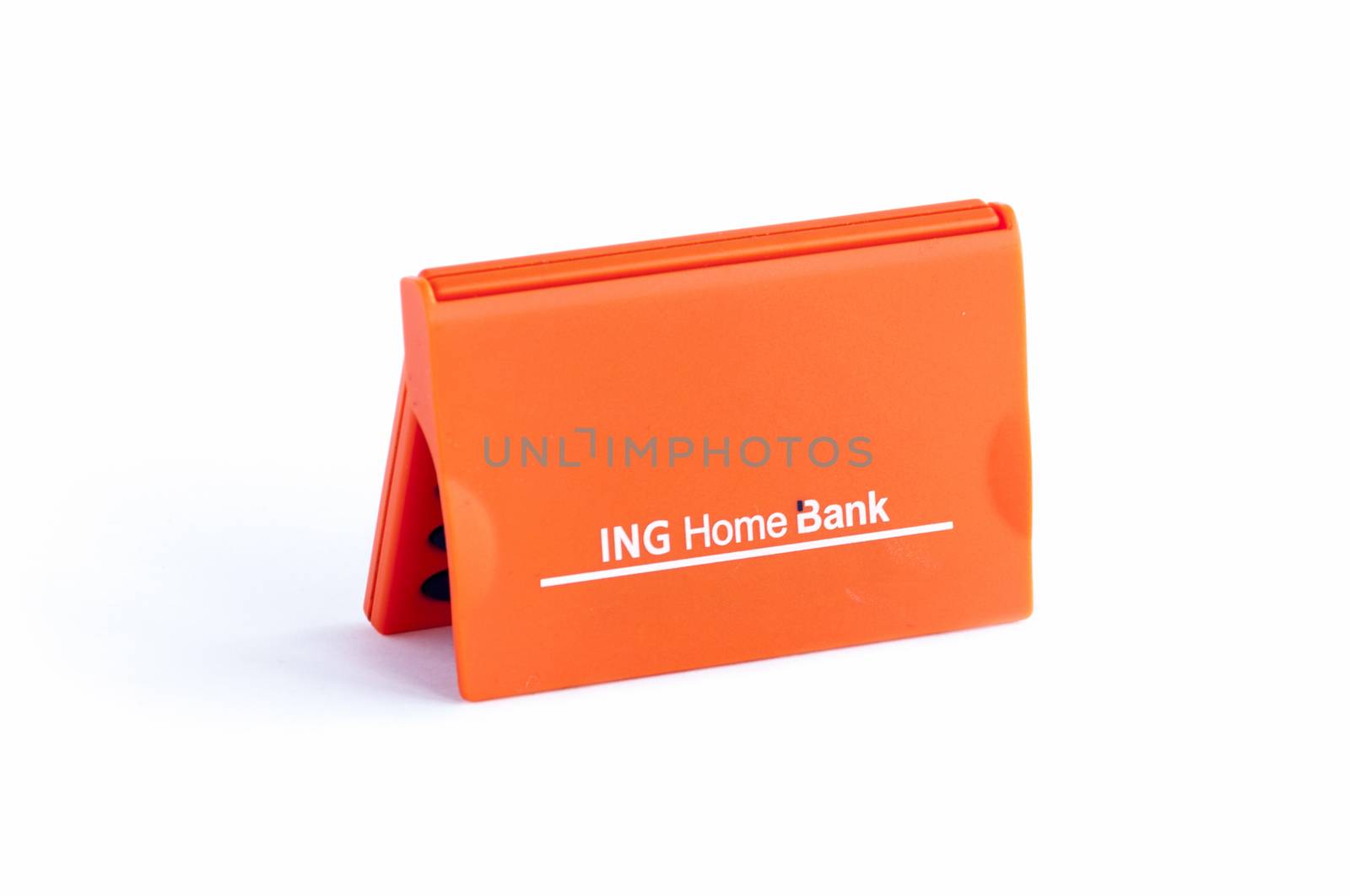 BUCHAREST, ROMANIA - FEB 17,2014: ING Home Bank token isolated on white. The ING Group is a Dutch multinational banking and financial services corporation headquartered in Amsterdam. 
