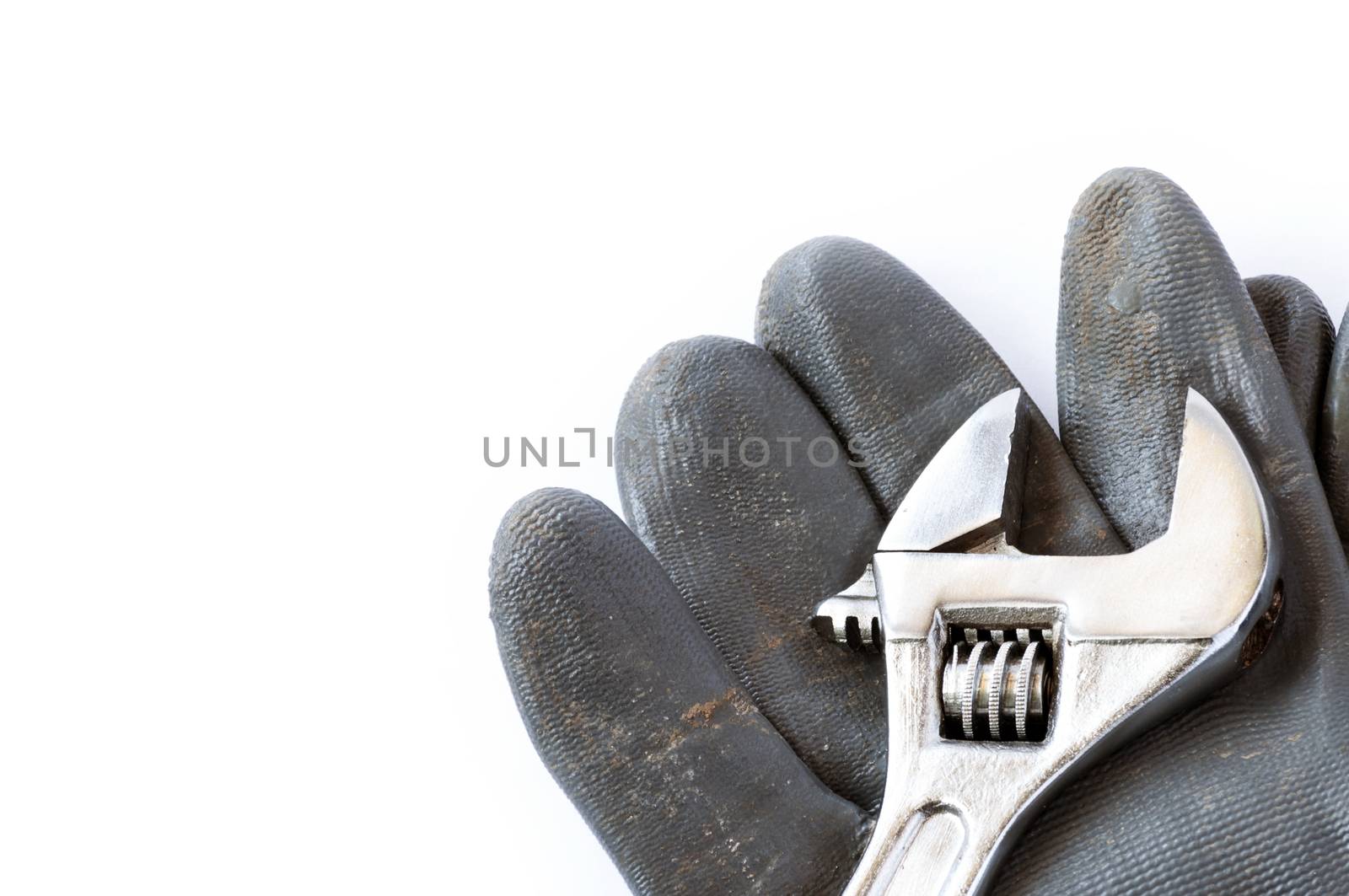 Tool and glove over a white background by maxmitzu