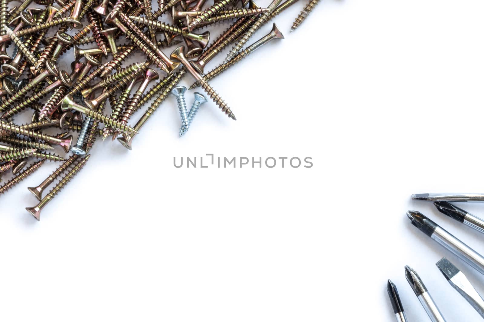 Set of screws and screwdrivers over a white background by maxmitzu