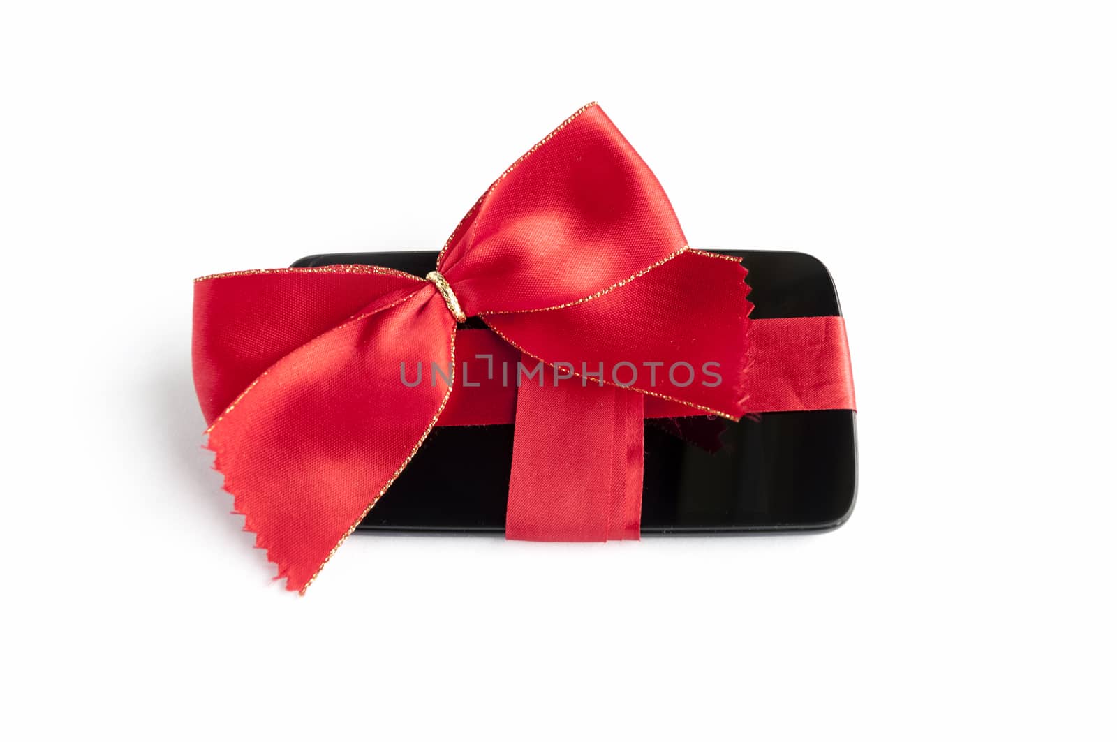 Smart Phone with Red Ribbon and Bow isolated on white background