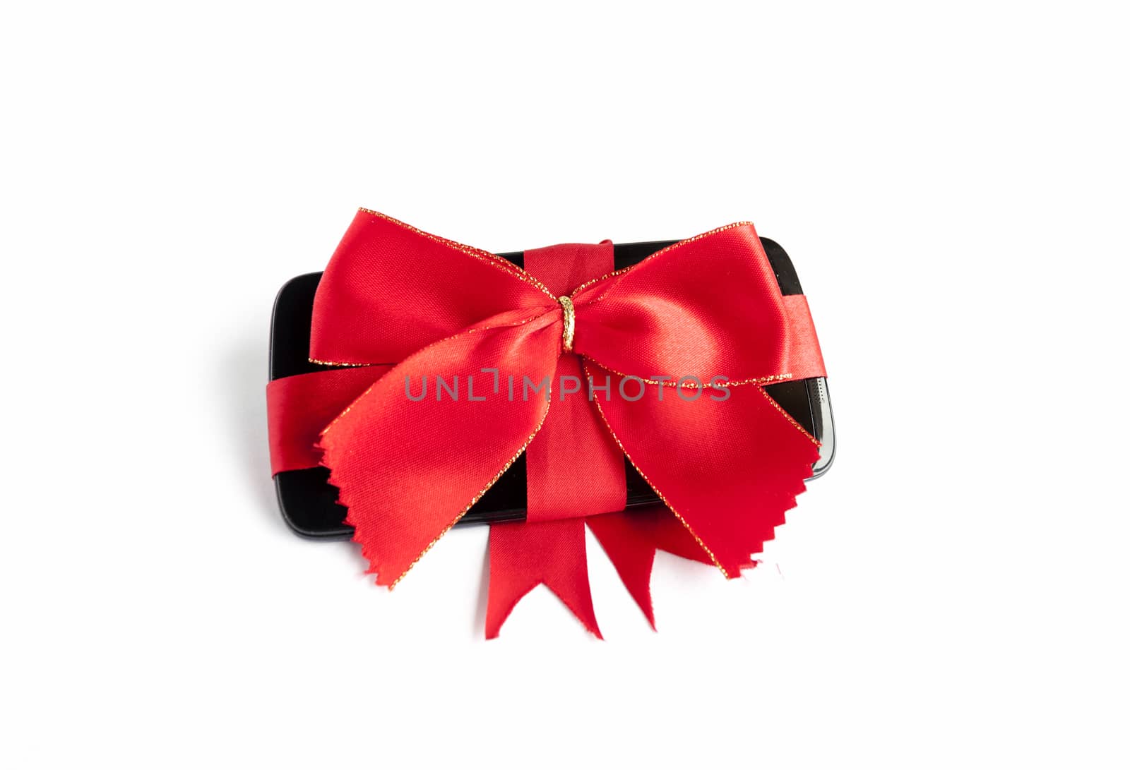 Smart Phone with Red Ribbon and Bow isolated on white background