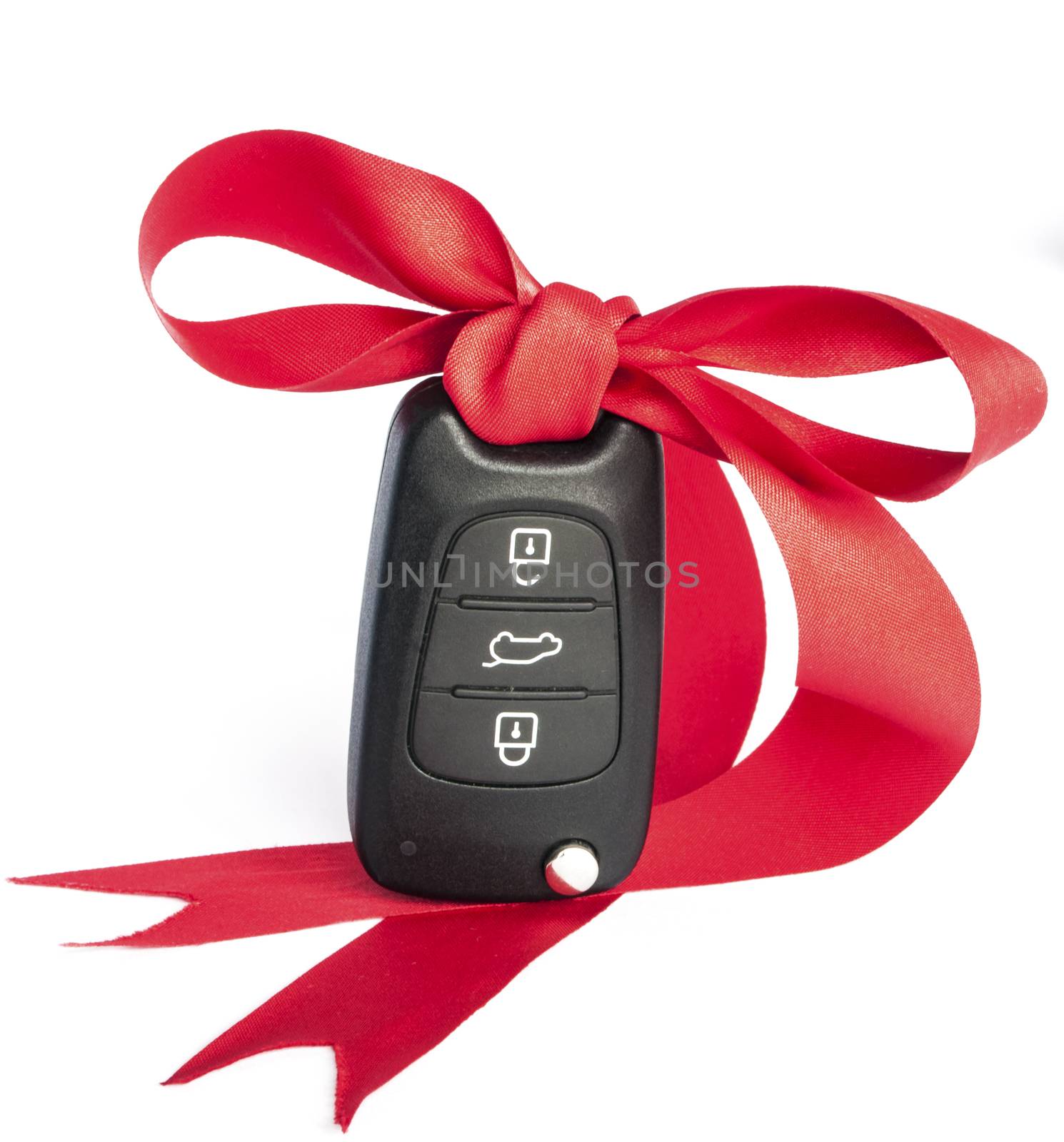 Gift key concept with red Bow on a white background.