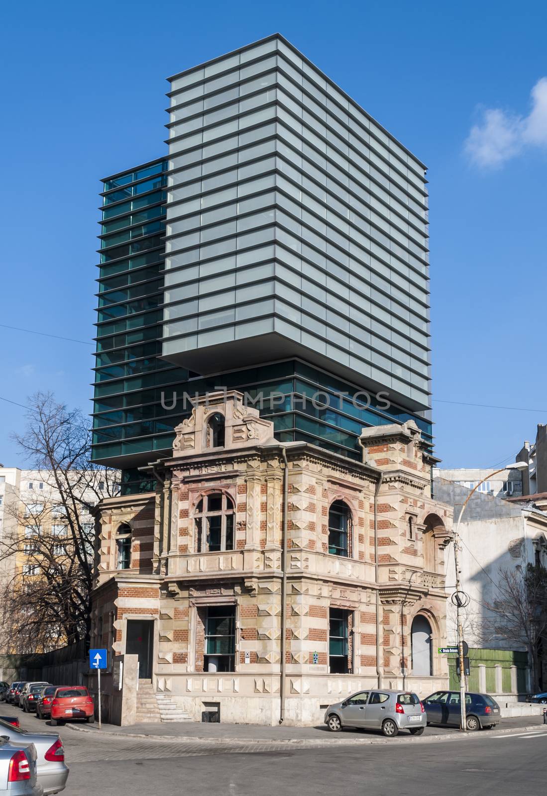 BUCHAREST, RO - March 03: Bucharest Modern Architecture combine with vintage Arhitecture on March 03, 2013 in Bucharest, Romania. Bucharest has prominent buildings in a variety of styles. by maxmitzu