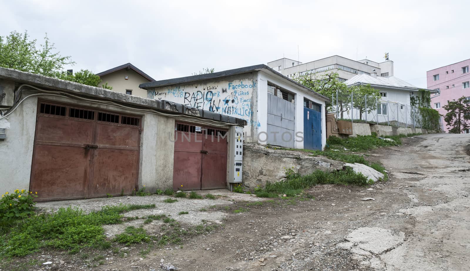 SUCEAVA - MAY 05: Old garages in the periphery of the city May 05, 2013 in Suceava, Romania. Suceava have a lot of this garages from the communist era. by maxmitzu