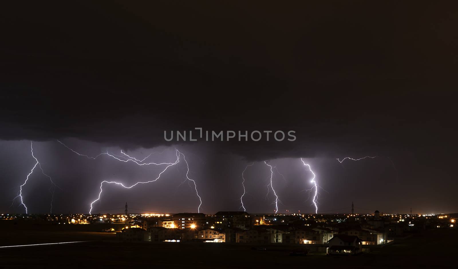 Severe lightning storm over a small city