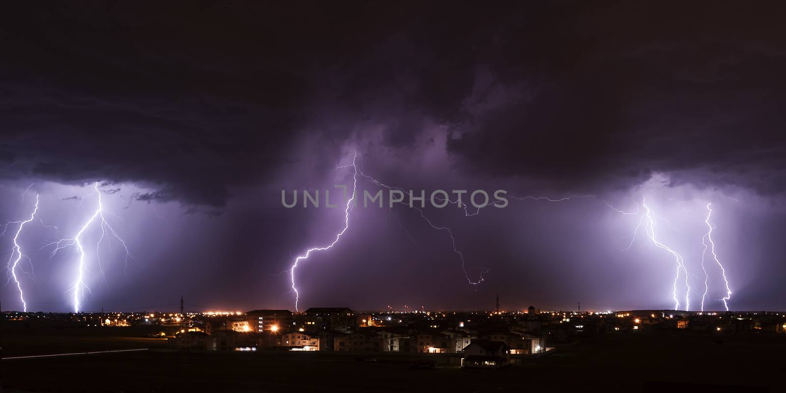 Severe lightning storm over a small city