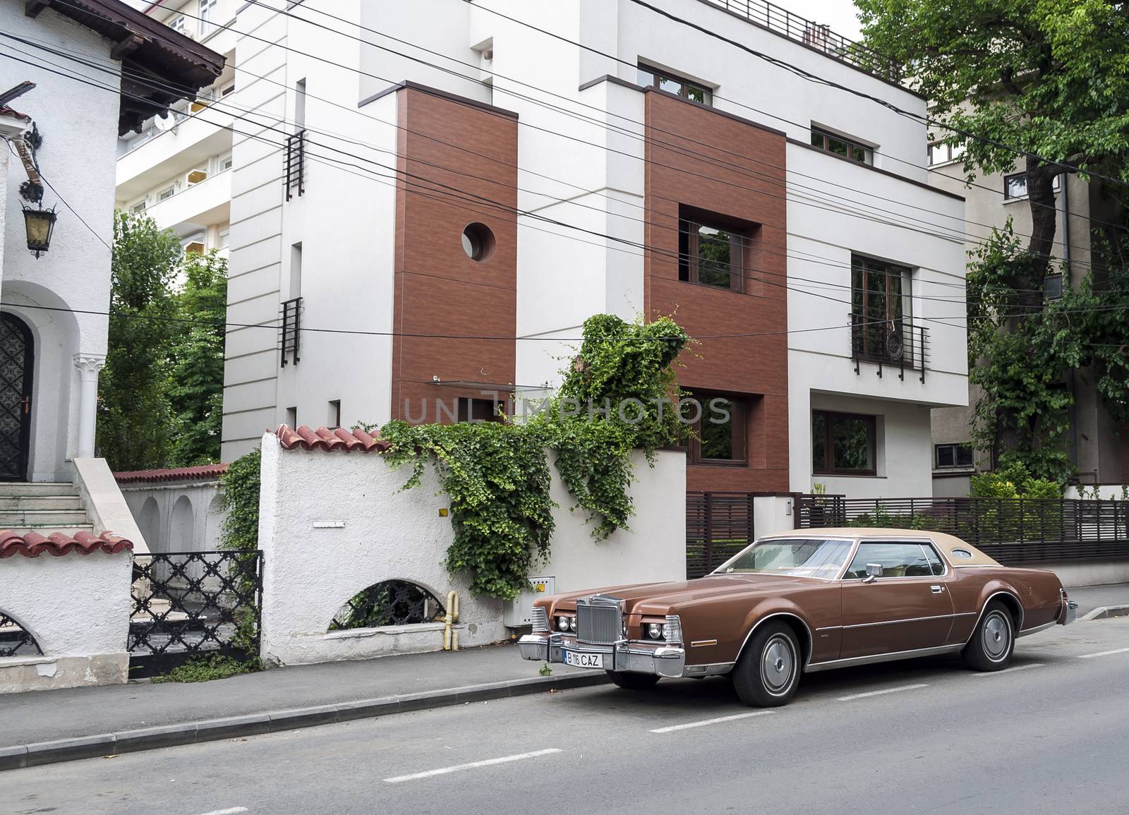 BUCHAREST-June 15: American classic car parked in the front of a by maxmitzu