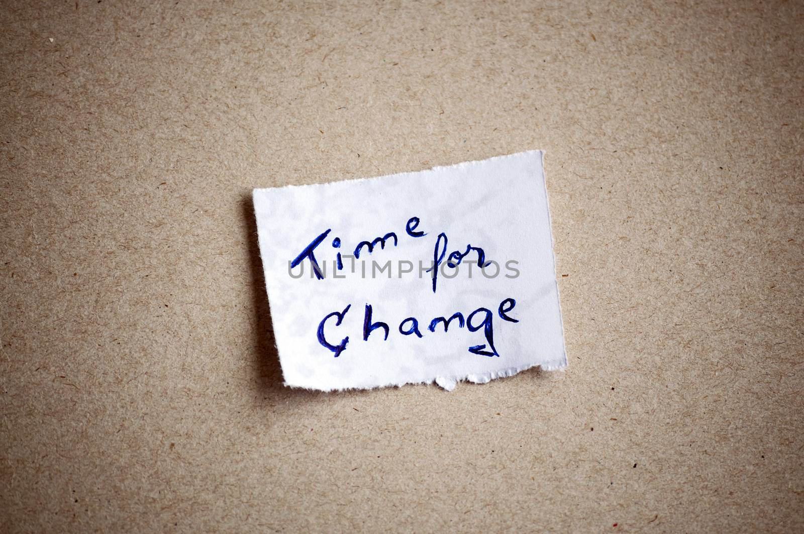Time for change message,written on piece of paper, on cardboard background. Space for your text.