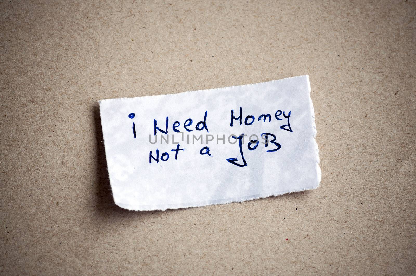 I need money, not a job message,written on piece of paper, on cardboard background. Space for your text.