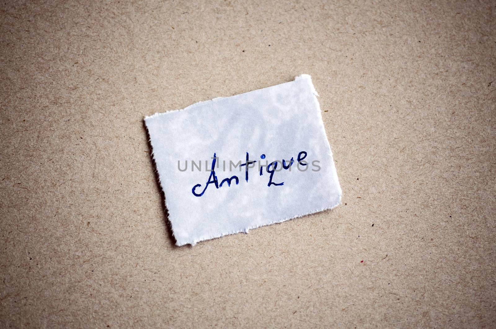 Antique message,written on piece of paper, on cardboard background. Space for your text.