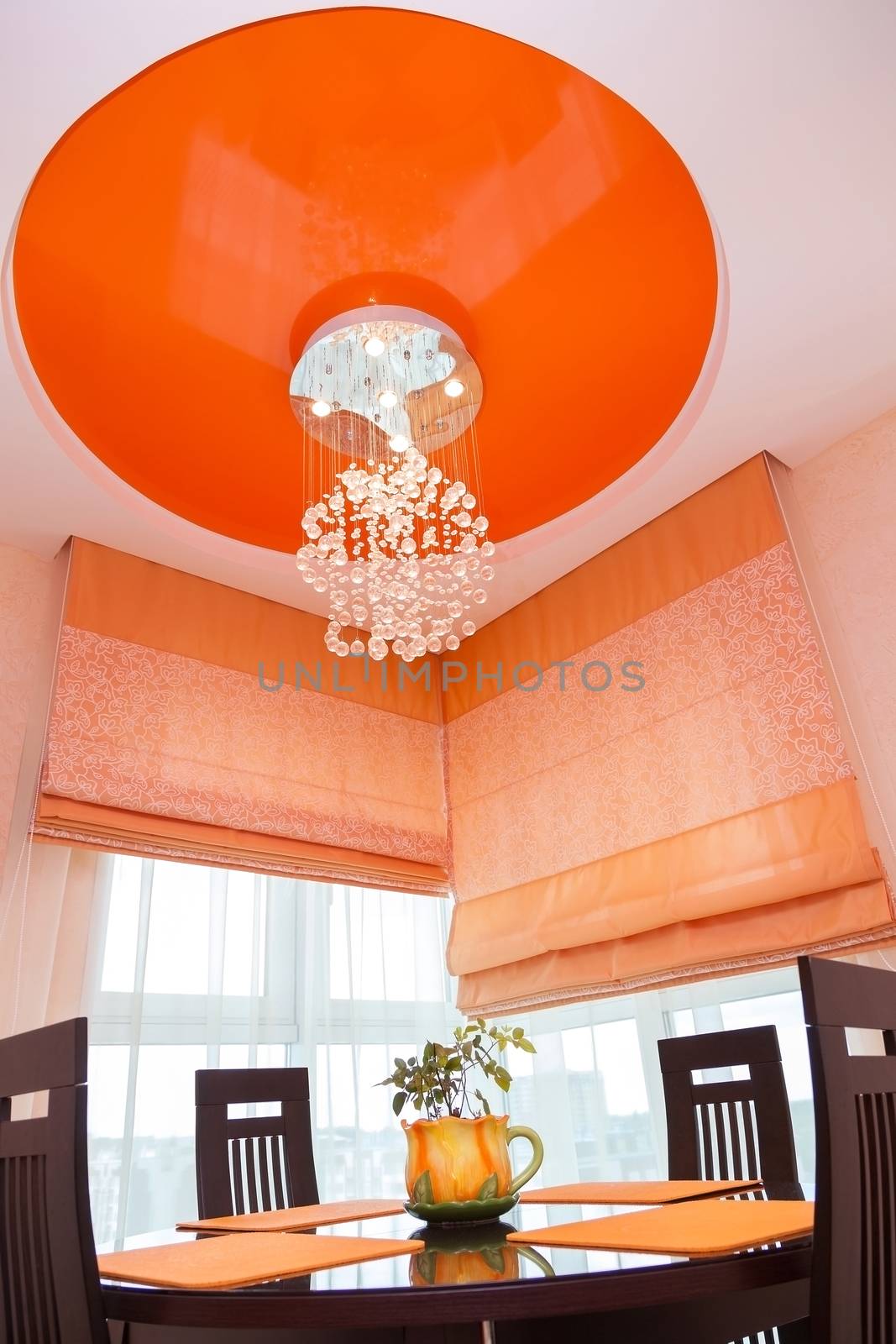 bright modern kitchen with a beautiful crystal chandelier