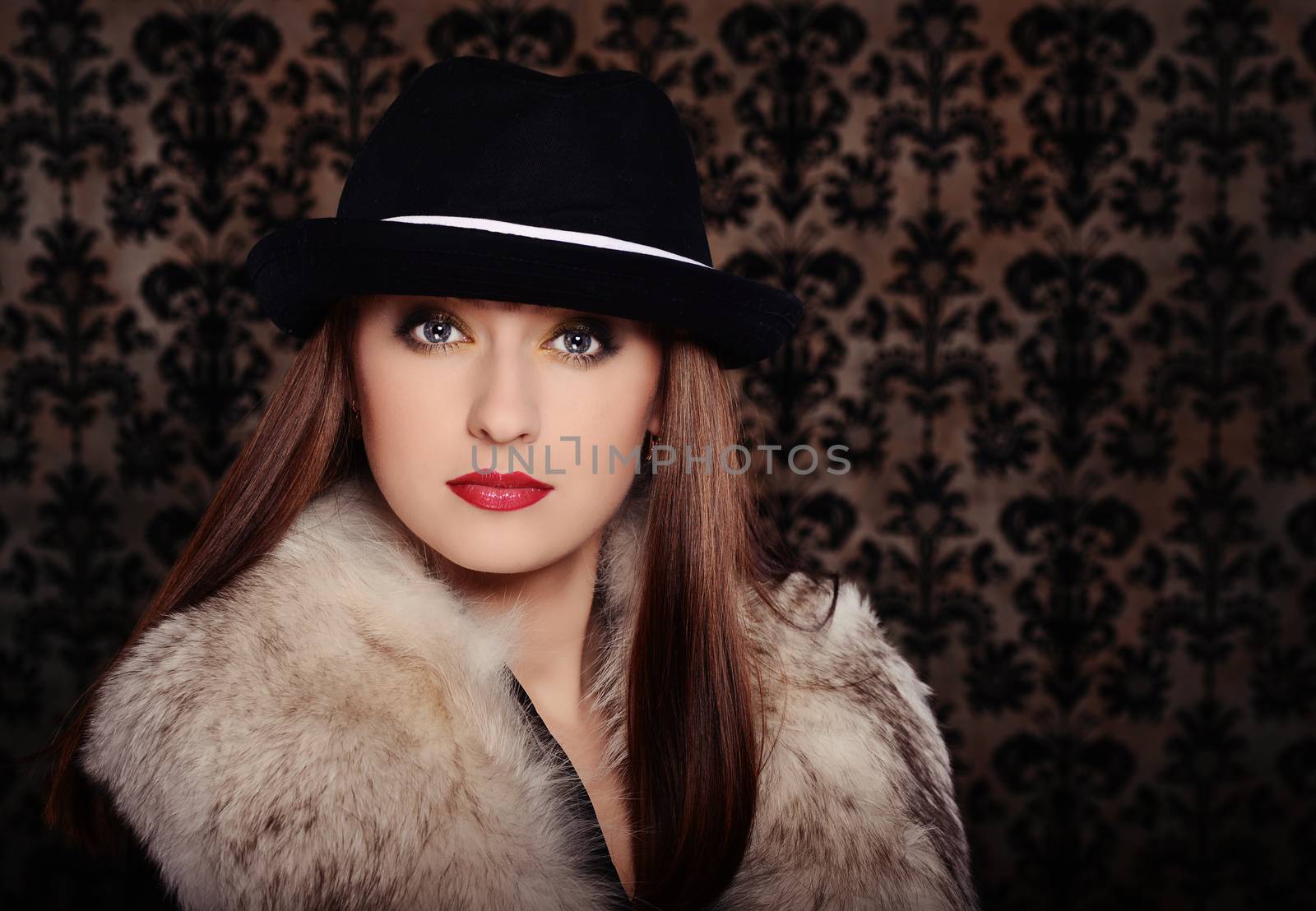 Beautiful woman in retro style over dark vintage background