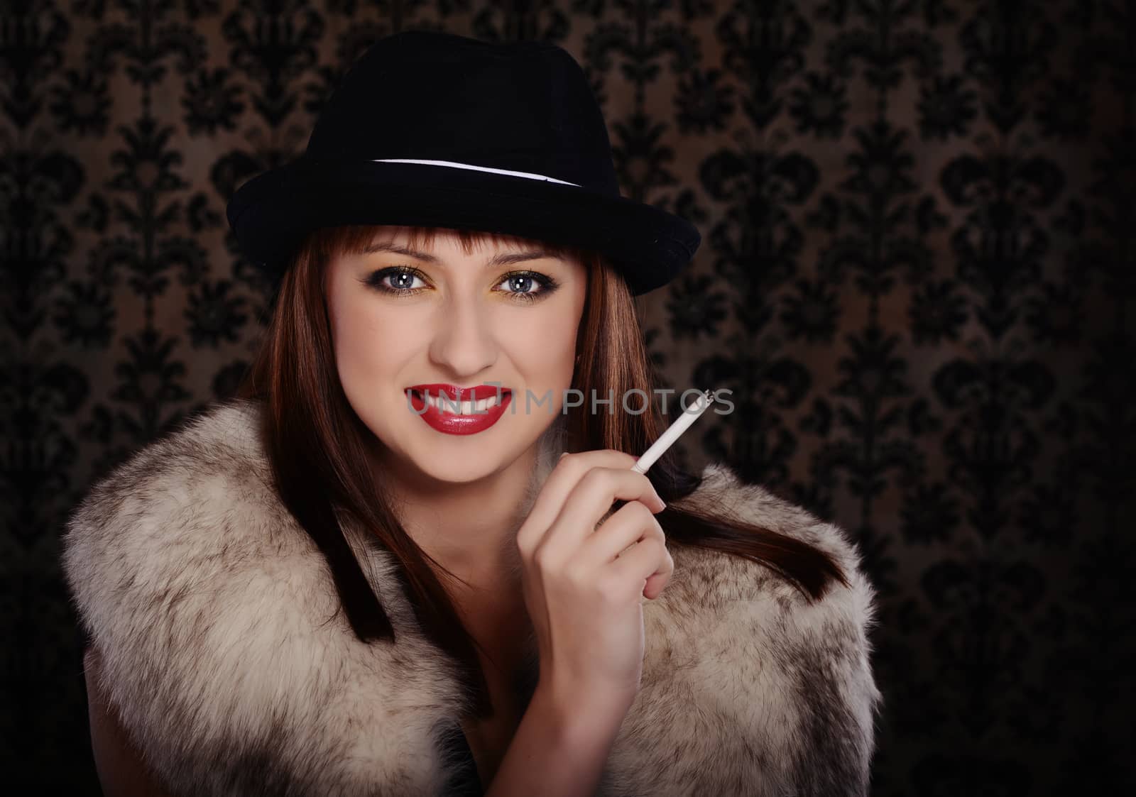 Beautiful woman in retro style over dark vintage background