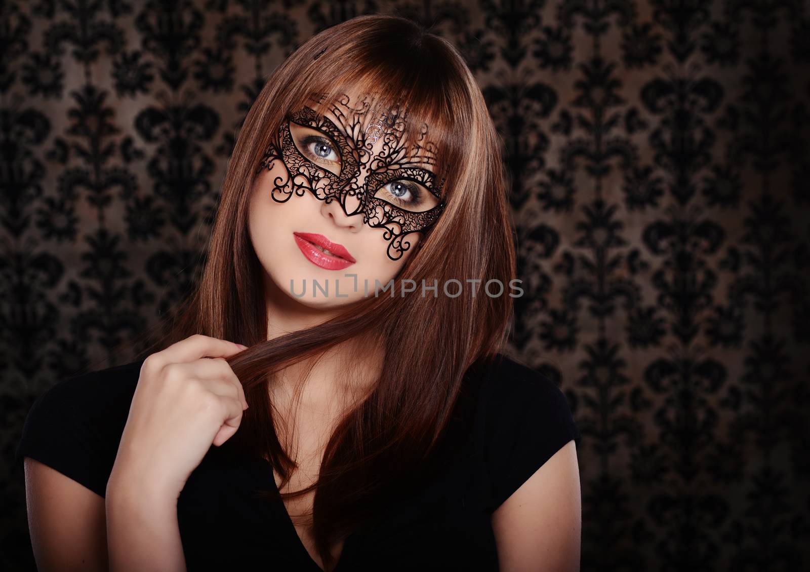 Beautiful woman in retro style over dark vintage background
